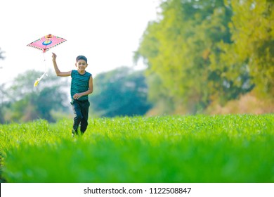 Indian Child Playing With Kite