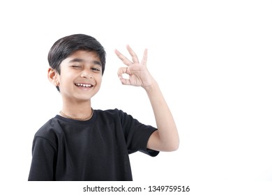 Indian Child Showing Nice Gesture With Hand