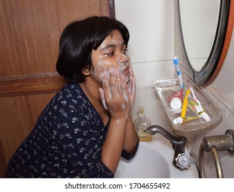 Indian Child Washing Face With Hands As A Prevention Against Corona Virus Flu Or Covid 19.

Delhi - India
April 2020 