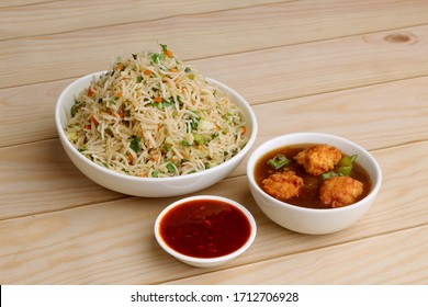 Indian Chinese Combo Dishes Or Group Of Dishes Named Veg Fried Rice, Chili Chicken Or Paneer, Chicken, Veg, Paneer Manchurian. Selective Focus