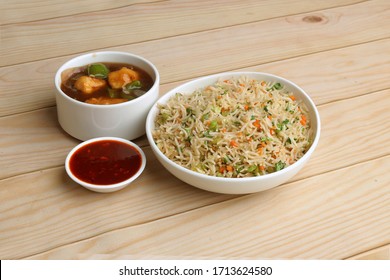 Indian Chinese Combo Dishes Or Group Of Dishes Named Veg Fried Rice, Chili Chicken Or Paneer, Chicken, Veg, Paneer Manchurian. Selective Focus