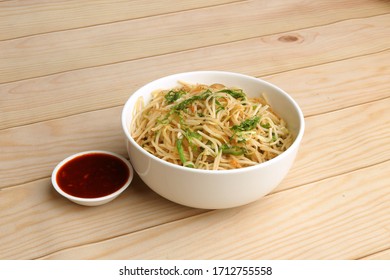 Indian Chinese Dish Veg Noodles Served In White Bowl On Wooden Background