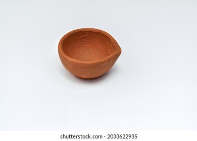 Indian clay oil lamp or diya used for Diwali and festival celebration with white background - Powered by Shutterstock