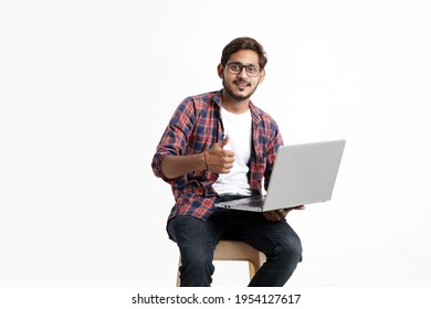 Indian College Student Using Laptop On White Background.