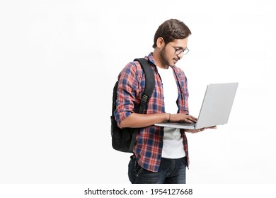 Indian College Student Using Laptop On White Background.