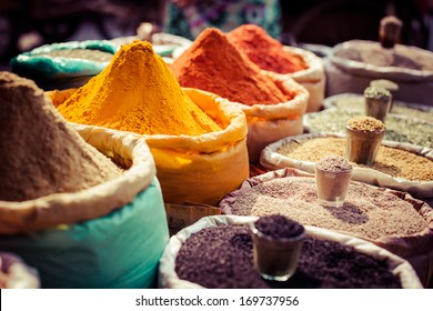 Indian colored spices at local market. - Shutterstock ID 169737956