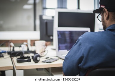 Indian Computer Engineering student coding on his laptop in a computer lab - Shutterstock ID 1340385209