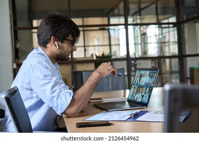 Indian corporate manager leading virtual multicultural business team work meeting workers group conference online remote video call. Company leader having distant videoconference on laptop. - Shutterstock ID 2126454962