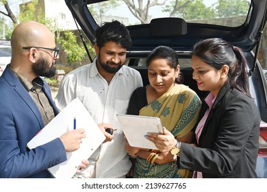 An Indian Couple Buying New Car From The Car Dealer