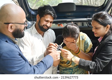 An Indian Couple Buying New Car From The Car Dealer