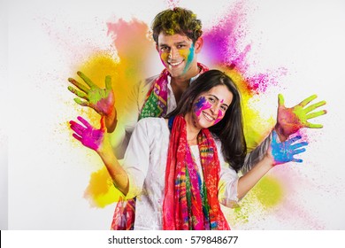 Indian Couple Celebrating Holi With Colour Splash