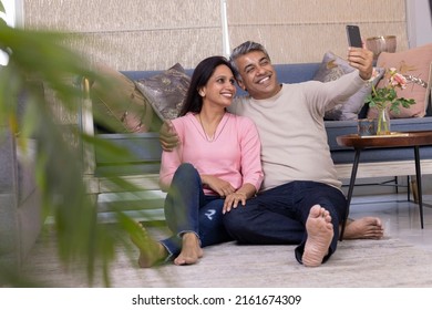 Indian Couple Poses For Smart Phone Selfie At Home