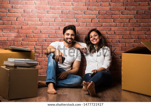 Indian Couple Relaxing While Shiftingunpacking Home Stock Ph