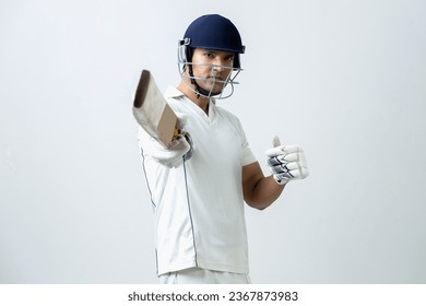 Indian cricketer lifting cricket bat towards the camera and celebrating his century, cricket concept - Powered by Shutterstock