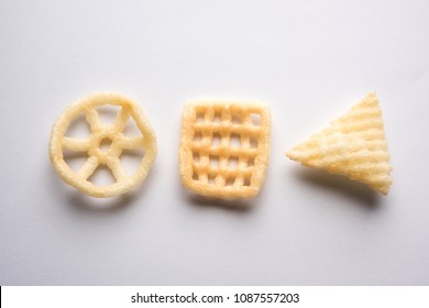 Indian crunchy fryums or papad snack in wheel, square and triangle shape. selective focus