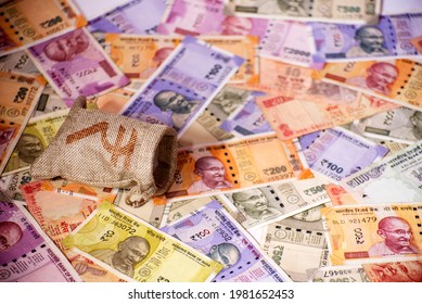 Indian Currency Bank Notes Background With Empty Money Bag. Top View Of Indian Rupee On A Table.