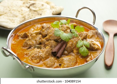 Indian Curry Lamb Rogan Josh In A Steel Karahi, With Naan Bread.