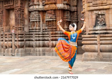 Indian Dancer posing at temple sculpture. Indian dance  - Shutterstock ID 2167977029