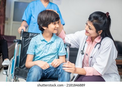 Indian doctor support disabled boy child patient sit on wheelchair at hospital, child healthcare concept - Powered by Shutterstock