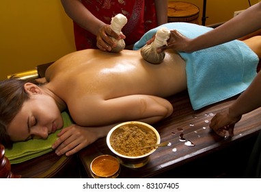   Indian Doctors Doing Traditional Ayurvedic Oil Back Massage