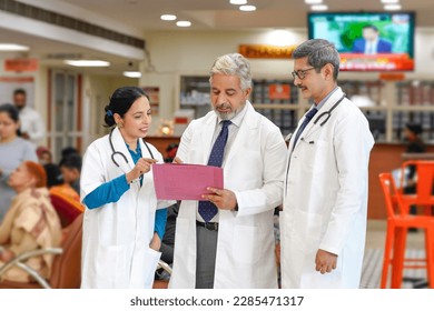 Indian doctors team watching report and discussing at hospital. - Powered by Shutterstock