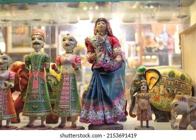 Indian Doll In Traditional Saree With Two Other Dolls In A Store For Sale. Doll In Blue Saree With Traditional Dolls On Display.