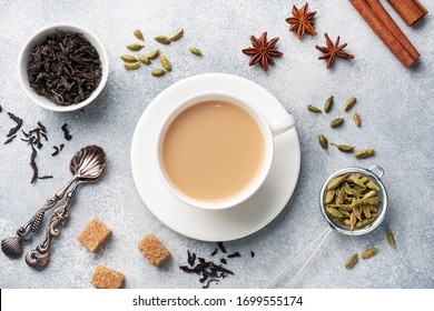 Indian Drink Masala Tea With Milk And Spices. Cardamom Sticks Cinnamon Star Anise Cane Sugar.