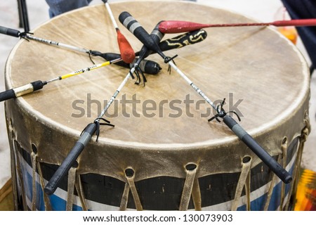 Indian drum and drum sticks placed in  a symbolic manner after the drummers complete their song at a Native American pow-wow.