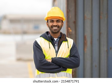 indian engineer man working in logistics at container port - migrant worker man concept - - Shutterstock ID 2154871791