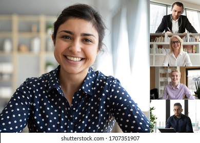Indian ethnicity businesswoman leading group on-line meeting full frame laptop screen web cam view. Work from home, easy and convenient usage of modern technologies, teleconference application concept