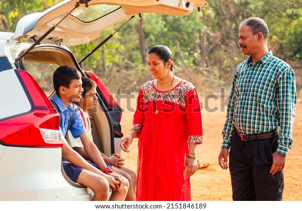 indian family buying a new car and ready to go\
on beach vacation