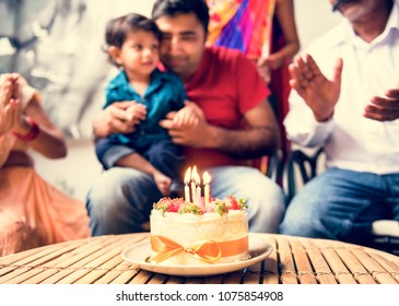 Indian Family Celebrating A Birthday Party