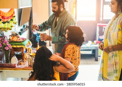 Indian Family Celebrating Religion Hindu Event At Home - Southern Asian Cultures And Lifestyle Concept - Focus On Man Face