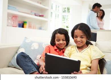 Indian Family With Digital Tablet At Home