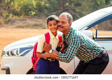 Indian Family Driving Boys To School In Front Of House Gates