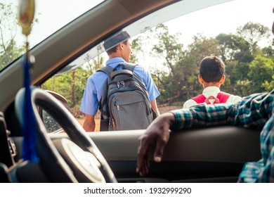 Indian Family Driving Boys To School In Front Of House Gates