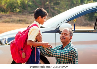 Indian Family Driving Boys To School In Front Of House Gates