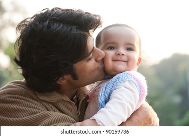 Indian Family, Father Holding The Daughter In His Lap