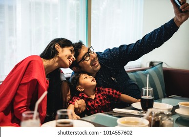 Indian Family Out In Restaurant