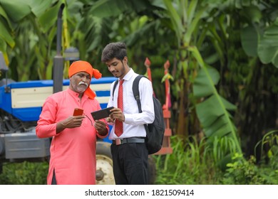 indian farmer discussing  some information  with agronomist - Powered by Shutterstock