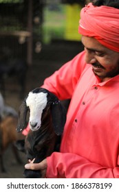 Indian Farmer In Goat Dairy Farm