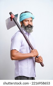 Indian Farmer Holding Farm Equipment In Hand And Giving Expression On White Background.