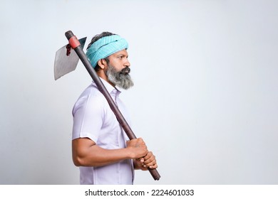 Indian Farmer Holding Farm Equipment In Hand And Giving Expression On White Background.