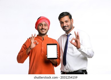 Indian Farmer Showing Tablet With Bank Officer Or Corporate Government Employee On White Background.