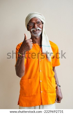 Indian farmer showing thumps up on white background