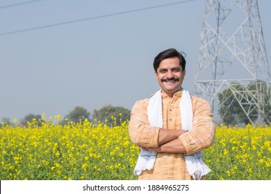 Indian farmer standing in agricultural field