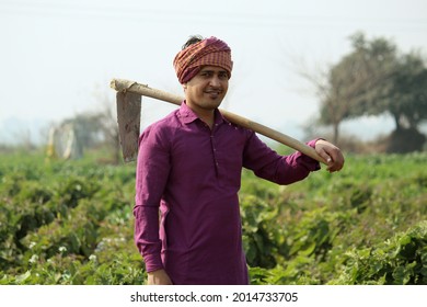 Indian Farmer Standing Holding Spade, Agricultural Field