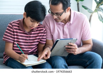 Indian Father Helps Him Check The Accuracy Of His Child's Math Homework, Educate At Home