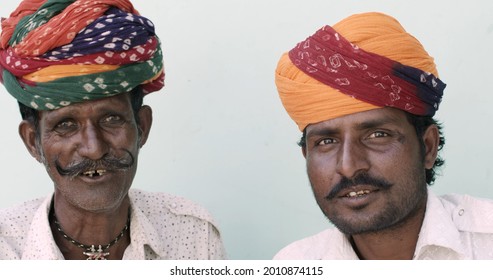 An Indian Father With His Son Wearing Turbans