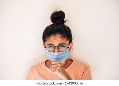 Indian Female Coughing While Wearing Medical Mask